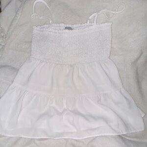 This xs, flowy white tank top is lovely in pictures!